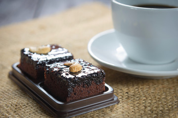 Coffee cup and coffee beans with brownie