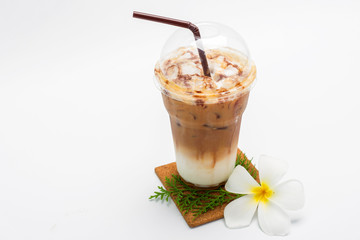 Iced coffee in plastic cup and Plumeria