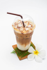 Iced coffee in plastic cup and Plumeria