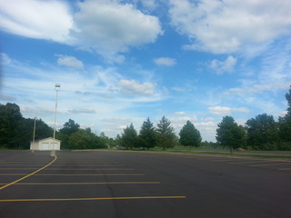 The sky with clouds at a parking lot.