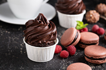 Chocolate cupcakes with thick and glossy frosting