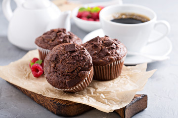 Fototapeta na wymiar Chocolate muffins with a cup of coffee