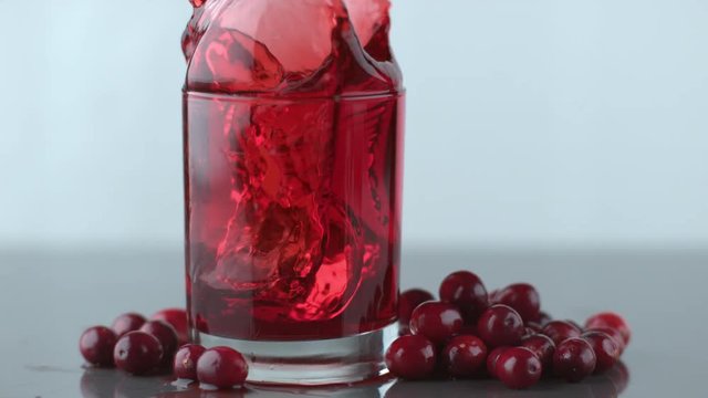 Ice splashing into cranberry juice in slow motion; shot on Phantom Flex 4K at 1000 fps