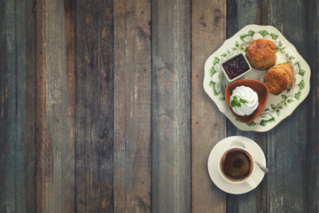 Cranberry Scones with coffee and sour cream on wood