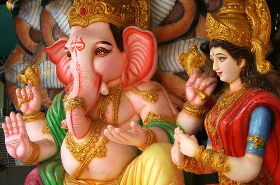 Ganesha and his consort Idol made out of POP material to offer prayers during 10 day long Hindu festival and  immersed in water bodies.
