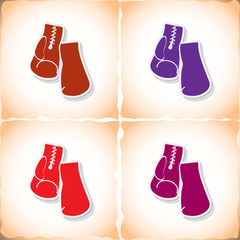 Boxing gloves. Flat sticker with shadow on old paper