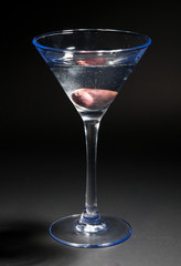Martini cocktail isolated on black background. Vertical shot