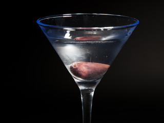 Martini cocktail isolated on black background. Horizontal shot,