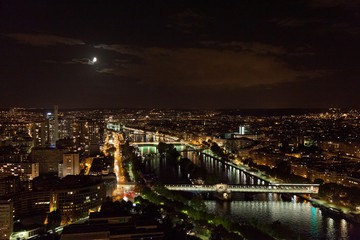 View from the Eiffel Tower at night. River and bridges in the fr
