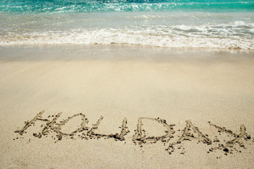 the inscription on the sand seashore