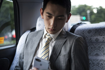 Businessman riding in the taxi