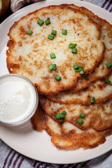 Potato pancakes with sour cream