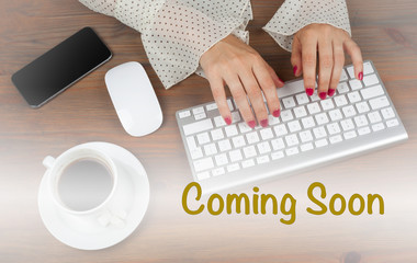 Coming Soon. Business woman working with computer