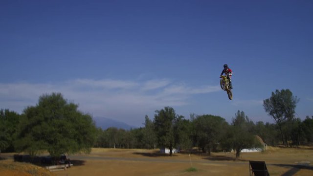 Motocross rider going off big jump, slow motion, 4K shot on RED Epic