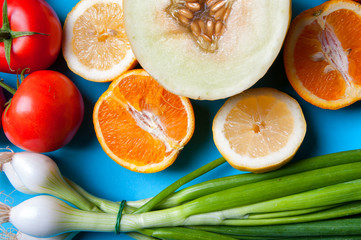Healthy vegetables and fruits on a blue background