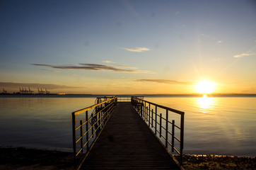 Fototapeta na wymiar Sunrise with a jetty in front