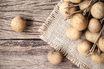 Fresh longan fruits on a wooden background