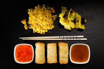 Baked spring rolls with deep, vegetables and rice.