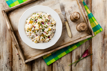 Traditional German potato salad with cucumber, onion and mayonna