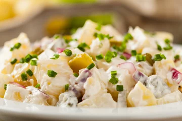 Poster Traditional German potato salad with cucumber, onion and mayonna © gkrphoto