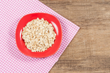 oats in plate on wood table