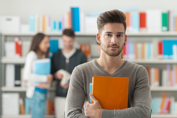 Confident student posing in the library