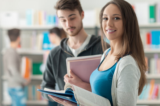 Happy students in the library