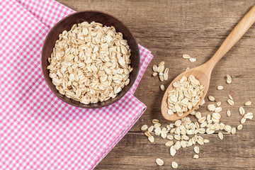 oats in spoon on wood table