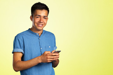 young man looking on his smartphone