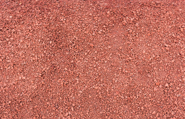 Small red lava stones beach texture