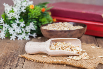 oats in spoon on wood table