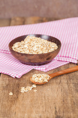 oats in spoon on wood table