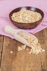 oats in spoon on wood table