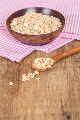 oats in spoon on wood table