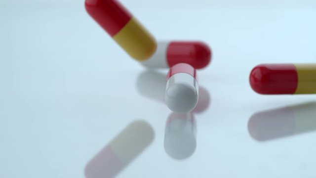 Pill capsules falling in slow motion