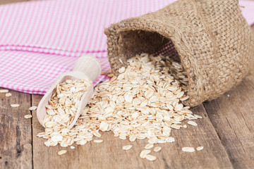 oats in spoon on wood table