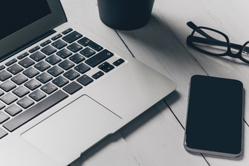 Laptop and other electronics on workspace