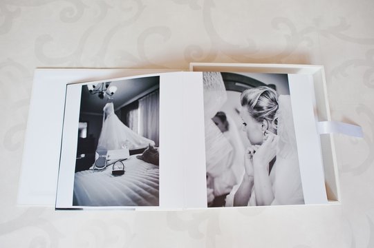 Dual pages of wedding photo book with wedding couple