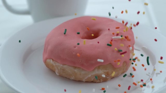 Sprinkles falling onto donut in slow motion; shot on Phantom Flex 4K at 1000 fps