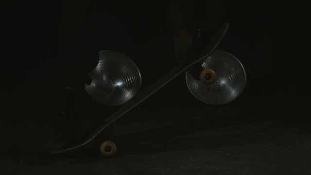 Skateboard kickflip with bright flash in slow motion