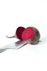 Red beet cut by knife