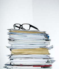 Paperstack with glasses on top