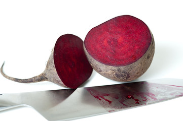Red beet cut by knife