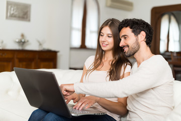 Couple using a laptop computer