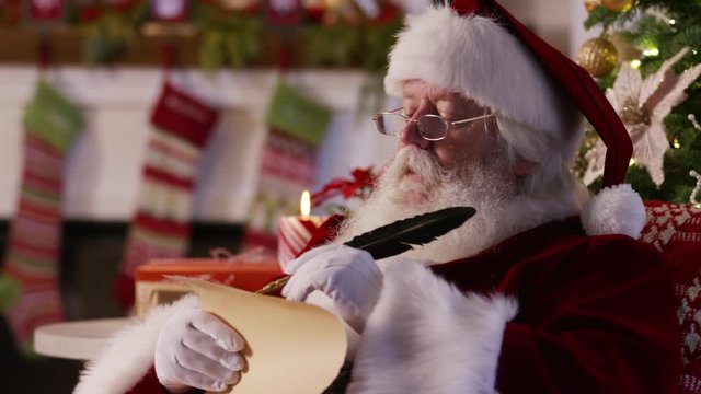 Closeup, Santa Claus writing on list