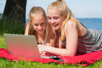 Two teenage girls enjoying summer