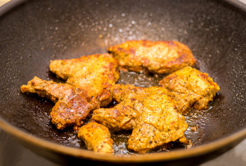 Fried pork steaks in curry