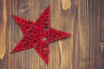 christmas star on brown wooden background