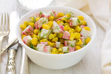salad seafood with corn in white bowl on white background