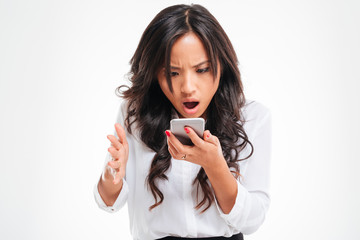 Disappointed asian businesswoman using smartphone